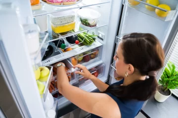 79606456_women-looking-for-food-inside-fridge-728x485